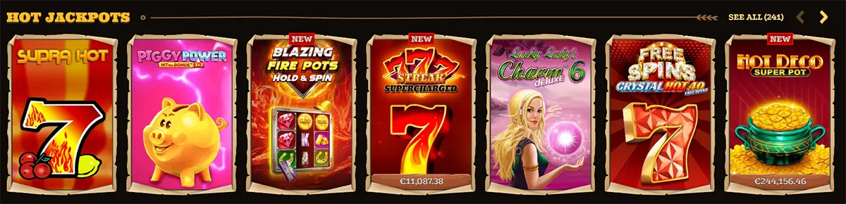 Hot Jackpots carousel showing slot game tiles: “Supra Hot”, “Piggy Power”, “Blazing Fire Pots Hold & Spin”, “777 Streak Supercharged”, “Lucky Lady’s Charm Deluxe 6”, “Free Spins Crystal Hot 40”, and “Hot Deco Super Pot”, with a “See all (241)” link and navigation arrows.